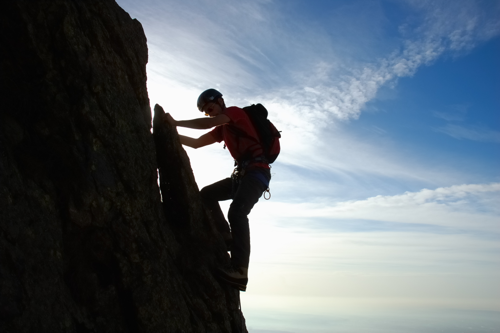 climbing a rock wall - featured image